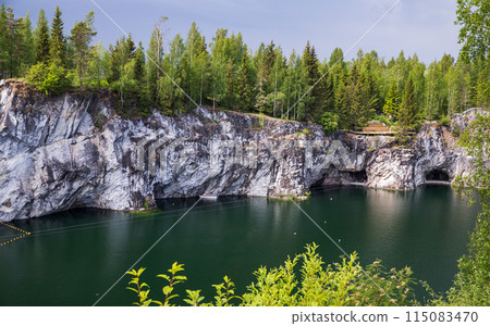 Karelian landscape with former marble quarry filled with groundwater Karelian landscape with former marble quarry filled with groundwater 115083470