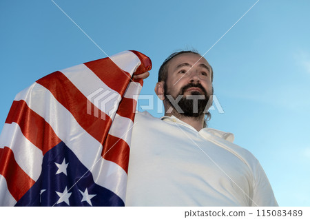 Patriot hipster man holding emotionally american USA flag. Patriot hipster man holding emotionally american USA flag. 115083489