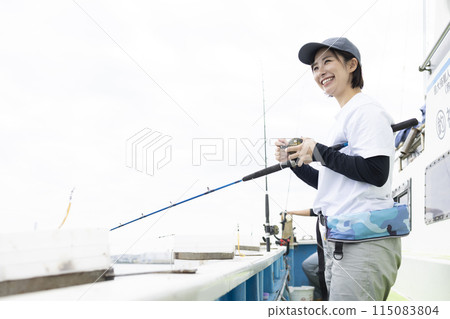 Cute woman enjoying fishing Cute woman enjoying fishing 115083804