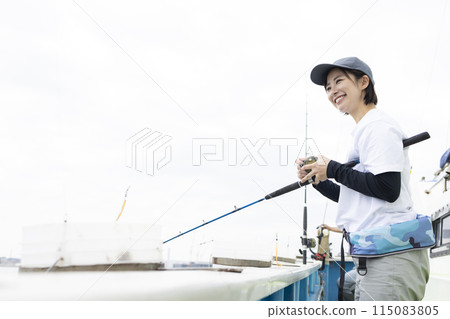 Cute woman enjoying fishing Cute woman enjoying fishing 115083805
