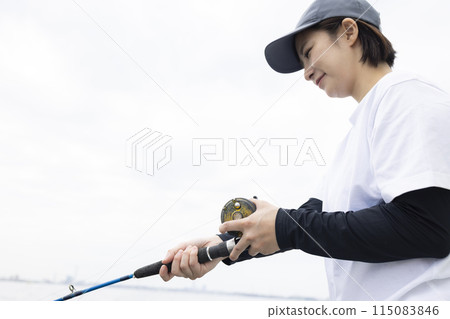 Cute woman enjoying fishing Cute woman enjoying fishing 115083846