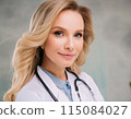 Close-up of woman in white lab coat and stethoscope 115084027