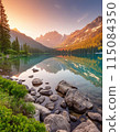 View of a lake and mountain range at sunset 115084350