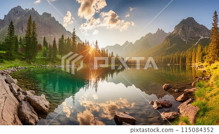 View of a lake and mountain range at sunset 115084352