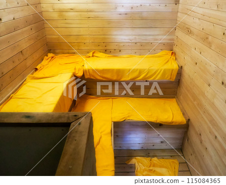 Sauna room with yellow towels 115084365