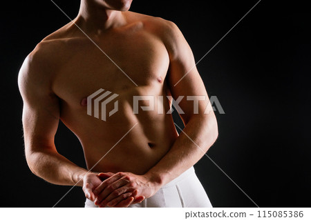 Portrait of man, bodybuilder and bicep flex in studio, background and exercise for muscular power. Portrait of man, bodybuilder and bicep flex in studio, background and exercise for muscular power. 115085386
