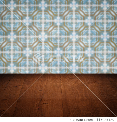 Wood table top and blur vintage ceramic tile pattern wall 115085529