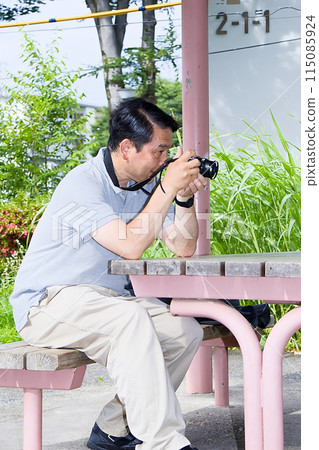 Senior male camera lover 115085924
