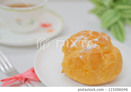 The perfect cream puff for tea time The perfect cream puff for tea time 115086046