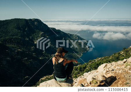 Hiking on Lycian way. Woman with backpack is trekking in beautiful nature  115086415