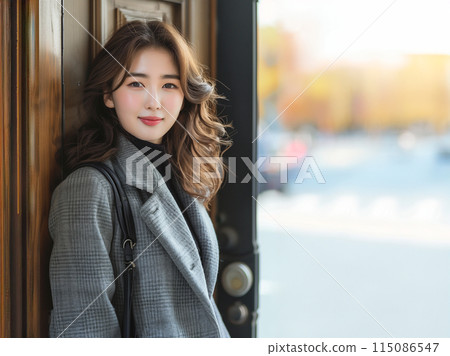 Smiling woman going out 115086547