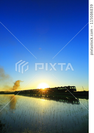 Rice fields and the SL Banetsu Monogatari at dusk 115086839