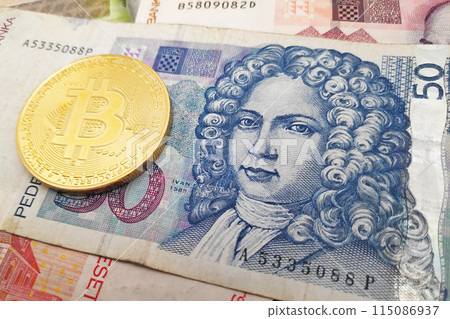 Bitcoin on a stack of Croatian Kuna banknotes 115086937