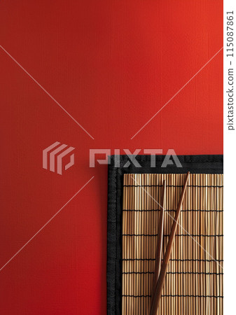 Two chopsticks and bamboo mat on cement background. Top view, copy space. 115087861