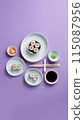 Aesthetic flat lay of sushi rolls arranged over a lilac background 115087956