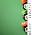 Set of sushi rolls top view over soft green background 115087960