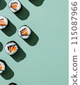 Set of sushi rolls top view over soft green background 115087966
