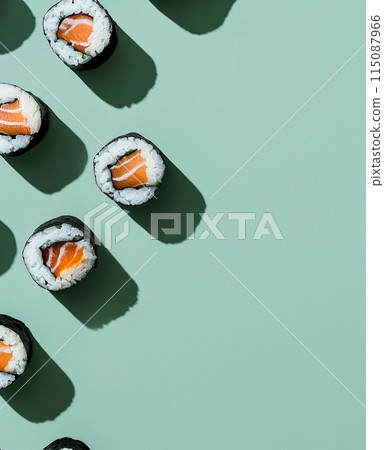 Set of sushi rolls top view over soft green background 115087966