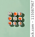 Set of sushi rolls top view over soft green background 115087967