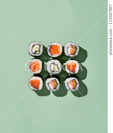 Set of sushi rolls top view over soft green background Set of sushi rolls top view over soft green background 115087967