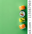Set of sushi rolls top view over soft green background 115087969