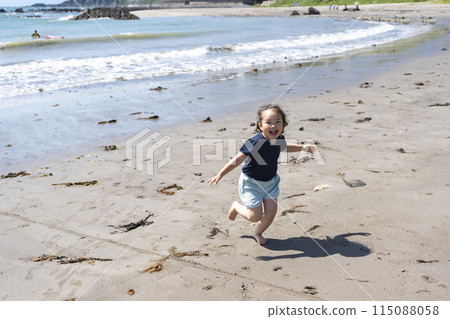Girls playing at the beach Girls playing at the beach 115088058