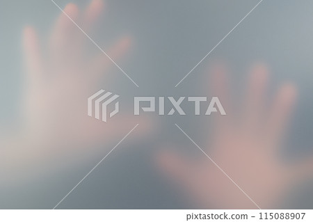 A hand reflected through frosted glass 115088907