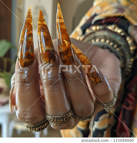 very long curved brown golden nails, close-up, unusual creative manicure, hand of clairvoyant, witch, sorceress 115089000