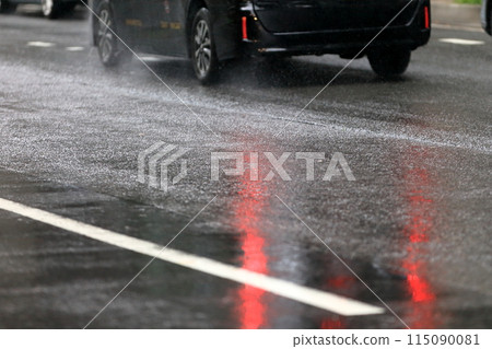 Wet road surface (asphalt pavement) Wet road surface (asphalt pavement) 115090081
