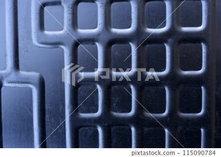 Shiny metal surface. The shiny radiator of an old refrigerator. Shiny metal surface. The shiny radiator of an old refrigerator. 115090784
