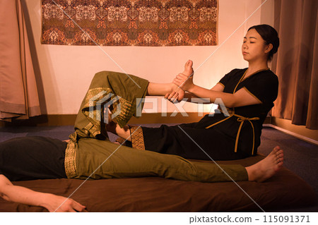 Japanese female therapist giving Thai massage 4 Japanese female therapist giving Thai massage 4 115091371