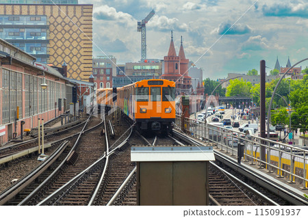 Yellow carriages of the famous Berlin metro on a sunny day. 115091937