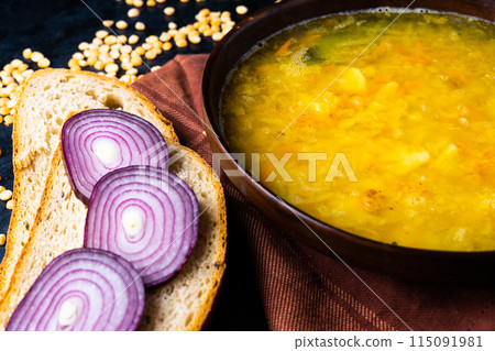 Homemade healthy vegetable soup with some bread and onion Homemade healthy vegetable soup with some bread and onion 115091981