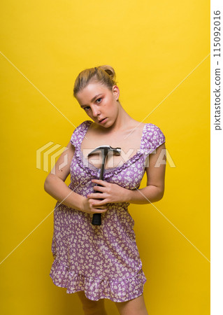 Seductive female handyman is going to fix it all, studio shot 115092016