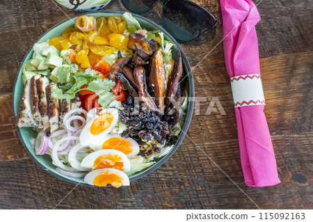 Mexican salad with chicken, eggs, yellow cherry tomatoes, onions and baked potatoes. Mexican salad with chicken, eggs, yellow cherry tomatoes, onions and baked potatoes. 115092163