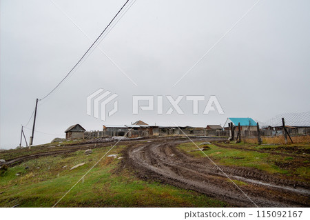 Gloomy autumn landscape of foggy morning in the village of Belyashi, Russia Gloomy autumn landscape of foggy morning in the village of Belyashi, Russia 115092167