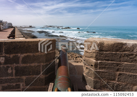 Historic cannon overlooking the ocean in Essaouira, Morocco. 115092453