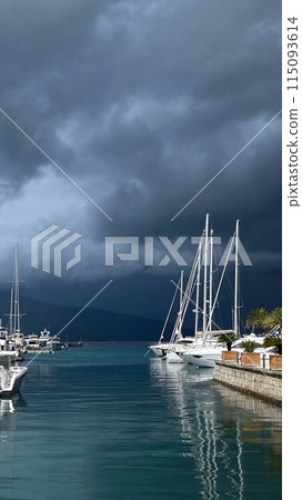 Stormy sky over tranquil harbor 115093614