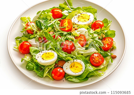 A perfect combination of delicious and healthy. Fresh salad with arugula, baby leaves, cherry tomatoes and boiled eggs. 115093685