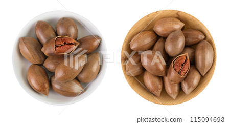 pecan nut in ceramic bowl isolated on white background with full depth of field. Top view. Flat lay. 115094698