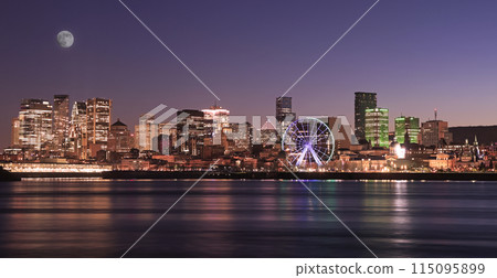 Montreal skyline illuminated at dusk and reflected in St. Lawrence River, Quebec, Canada Montreal skyline illuminated at dusk and reflected in St. Lawrence River, Quebec, Canada 115095899