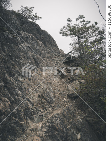 Going through rocky areas on the mountain trail 115096530