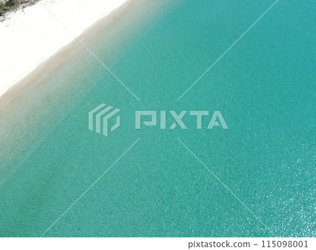 Aerial view of a blue sea surface water texture background and sun reflections Aerial flying drone view water surface texture on sunny tropical ocean Aerial view of a blue sea surface water texture background and sun reflections Aerial flying drone view water surface texture on sunny tropical ocean 115098001