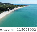 Aerial view of a blue sea surface water texture background and sun reflections Aerial flying drone view water surface texture on sunny tropical ocean 115098002