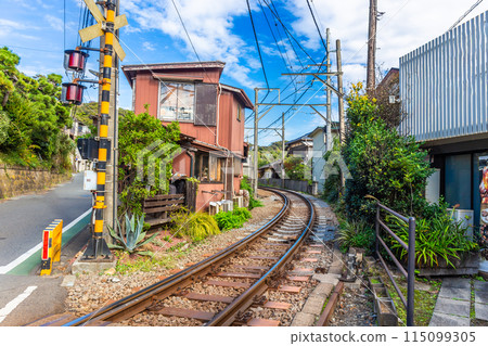 Kamakura's famous cafe next to the train tracks, sit or stand and eat food or drink and watch the trains pass by up close Japan 115099305
