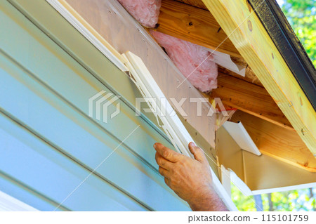 During construction exterior of house, damaged plastic siding is replaced 115101759