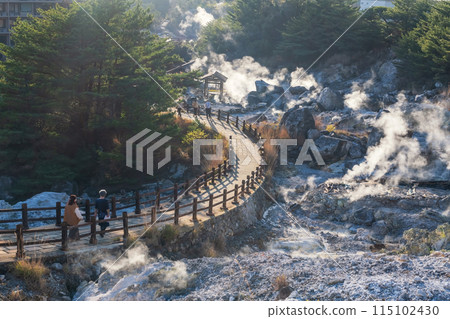 people walk downhill to Hell valley Jigoku at Mt. Unzen onsen, Nagasaki 115102430