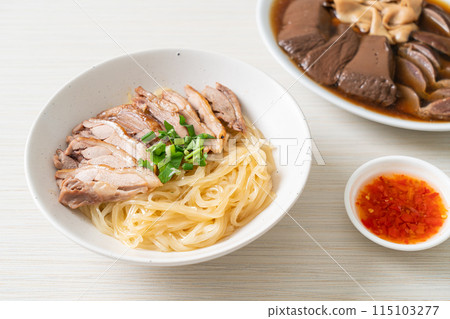 dried noodles with stewed duck in white bowl 115103277