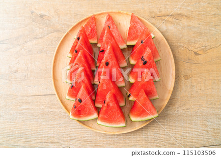 fresh watermelon sliced on plate 115103506