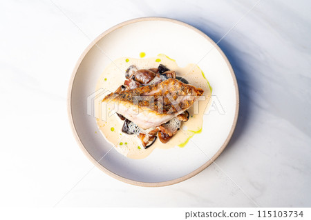grilled Barramundi steak with mushroom sauce 115103734